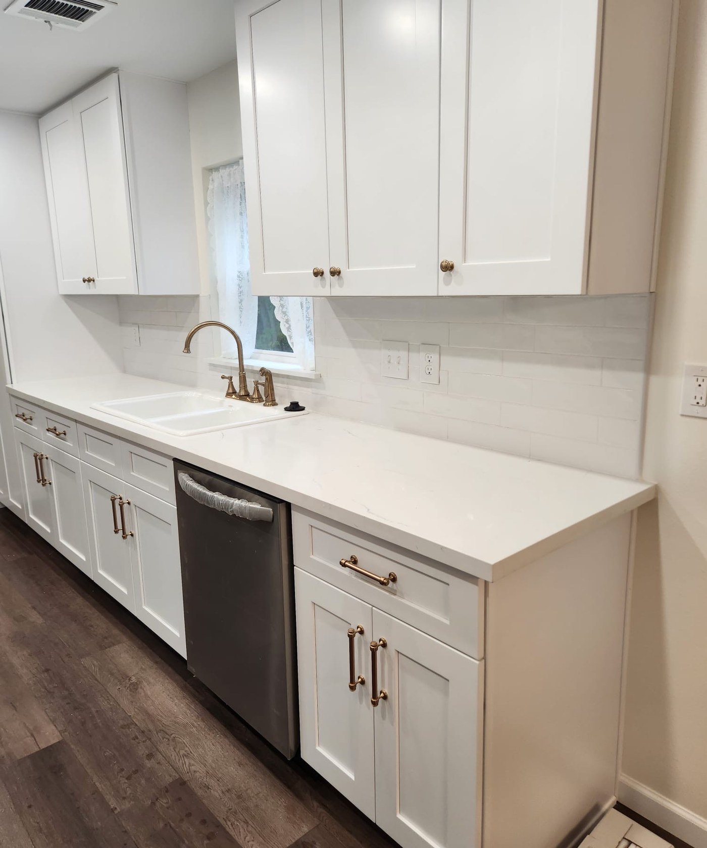 White cabinets with brass hardware